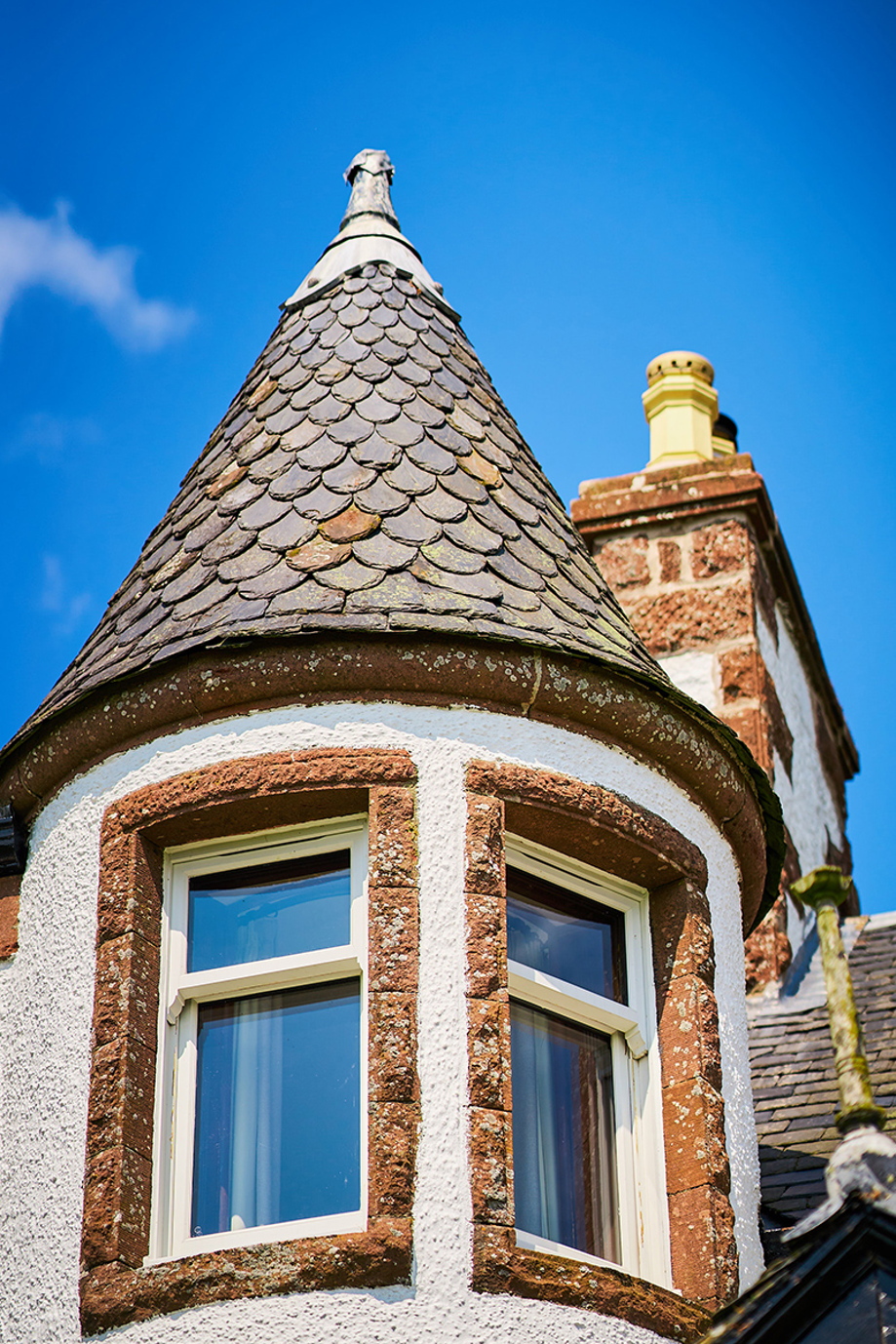 Blue skies with turret at Kinclune House in foreground